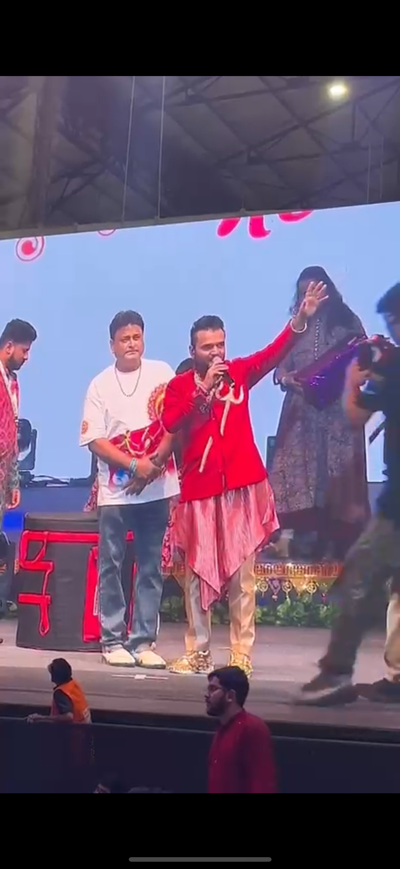 Customer wearing Parambhakt Garba Night Oversized T-Shirt on stage at Goregaon, Mumbai NESCO event