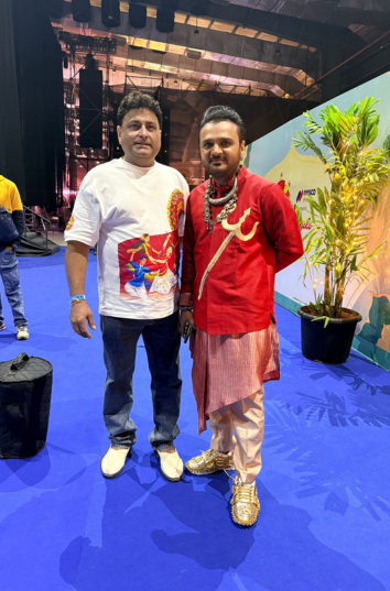 Customer wearing our Garba Night Oversized T-shirt seen with Parthiv Gohil singer of the event