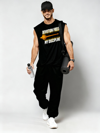 Man in Parambhakt Devotion oversized tank top holding a water bottle and yoga mat, featuring Hanumanji’s gada design.