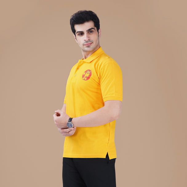 Man wearing the yellow Parambhakt Ganeshji Polo, showcasing the subtle Ganesh ji artwork on the chest against a neutral studio background.