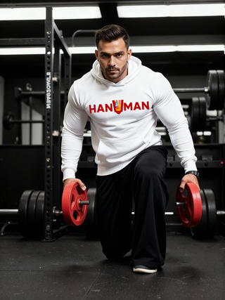 Man wearing a white Parambhakt ‘Hanuman in U’ Training Hoodie performing a lunge with weight plates inside a gym.