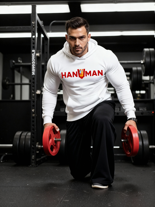 Man wearing a white Parambhakt ‘Hanuman in U’ Training Hoodie performing a lunge with weight plates inside a gym.