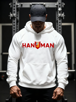 Man wearing a white Parambhakt ‘Hanuman in U’ Training Hoodie while standing in a gym setup.