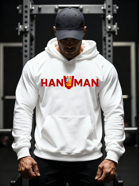 Man wearing a white Parambhakt ‘Hanuman in U’ Training Hoodie while standing in a gym setup.