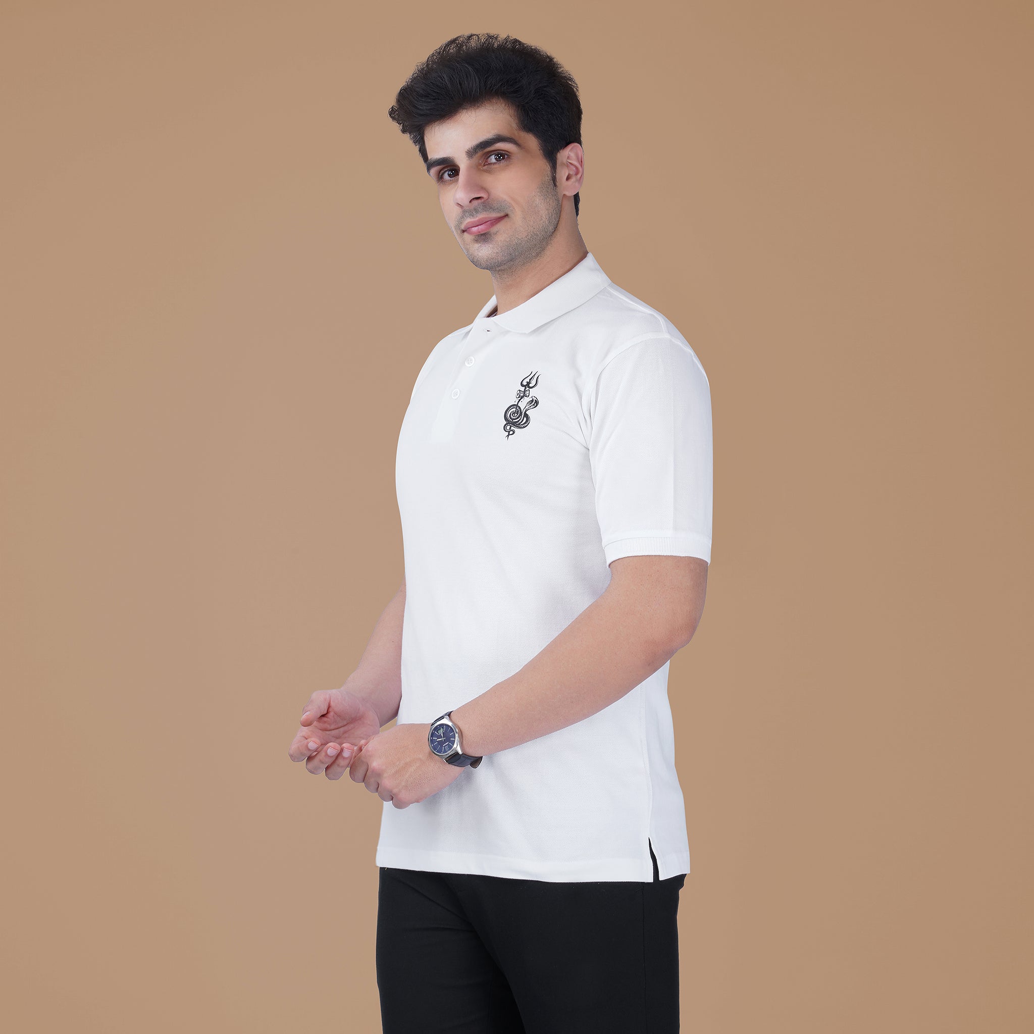 Side view of a model wearing the white Parambhakt Shivji Trishul Polo featuring a subtle Shivji inspired design.