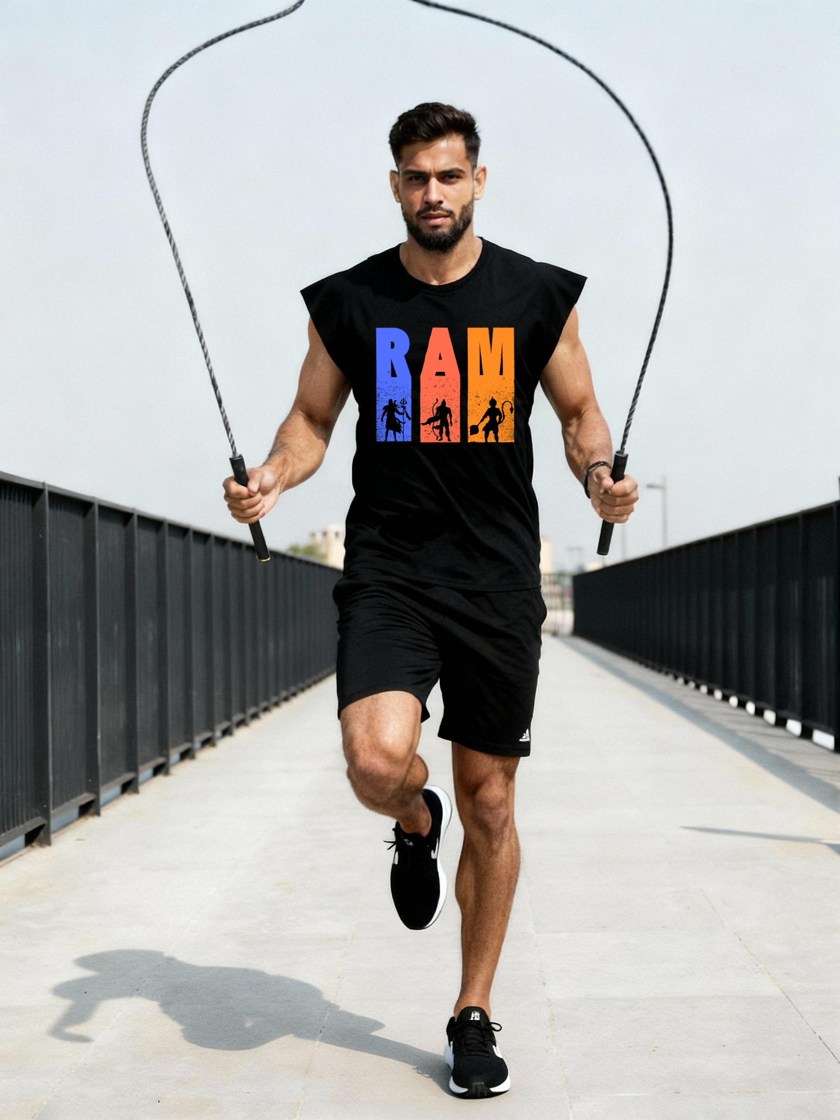 Man doing a skipping workout while wearing the Parambhakt Tridev Oversized Tank Top with the bold RAM graphic.